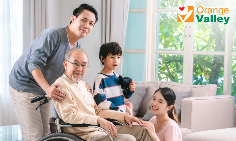 A family visiting an elderly man at a nursing home.