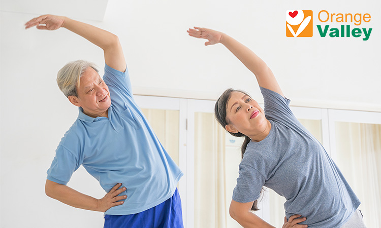 Seniors performing gentle stretching exercises to reduce daily tiredness.